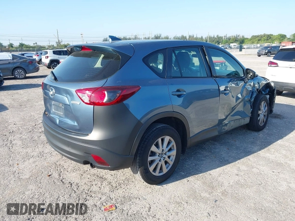 2016 Mazda CX-5 Sport with VIN JM3KE2BY8G0864983, listed as a IAAI auction lot 42072385 with 141,104 mi miles. Bid and sale history available at carsss.com. Image 4.