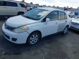 2007 Nissan Versa 1.8 S with VIN 3N1BC11E47L439072, listed as a IAAI auction lot 42083801 with 215,096 mi miles. Bid and sale history available at carsss.com. Image 2.