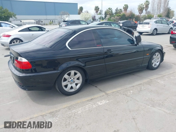 2002 BMW 3 Series 325Ci with VIN WBABN33482JW53230, listed as a IAAI auction lot 41912031 with 211,631 mi miles. Bid and sale history available at carsss.com. Image 4.