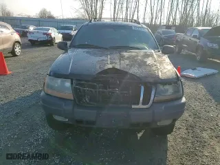 1999 Jeep Grand Cherokee Laredo with VIN 1J4GW58N1XC737706, listed as a Copart auction lot 83107914 with 0 mi miles and Salvage Title. Bid and sale history available at carsss.com. Image 11.