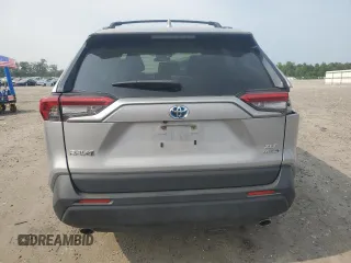 2023 Toyota RAV4 Hybrid XLE with VIN JTMRWRFV7PD166743, listed as a Copart auction lot 59964505 with 87,404 mi miles and Salvage title. Bid and sale history available at DreamBid. Image 6.
