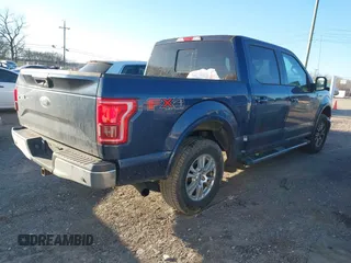 2015 Ford F-150 XLT with VIN 1FTEW1EP7FFD00589, listed as a IAAI auction lot 41677203 with 156,064 mi miles. Bid and sale history available at carsss.com. Image 4.