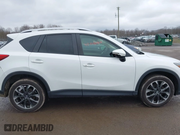 2016 Mazda CX-5 Grand Touring z VIN JM3KE4DY0G0705884, wystawiony jako IAAI lot #42016910 z przebiegiem 73 324 mil mil oraz . Historia ofert i sprzedaży dostępna na DreamBid. Obrazek 13.