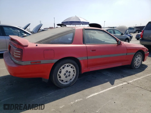 1989 Toyota Supra z VIN JT2MA70J3K0114537, wystawiony jako Copart lot #72587854 z przebiegiem 189 813 mil mil oraz Czysty tytuł • Clean title. Historia ofert i sprzedaży dostępna na DreamBid. Obrazek 3.