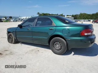 1999 Mazda 626 ES with VIN 1YVGF22C1X5896686, listed as a Copart auction lot 72012584 with 123,672 mi miles and Salvage Title. Bid and sale history available at carsss.com. Image 2.