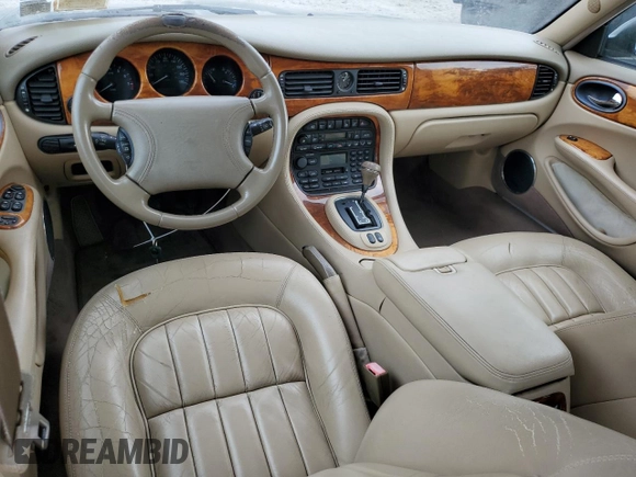 1999 Jaguar XJ with VIN SAJHX1044XC865054, listed as a Copart auction lot 57825325 with 71,145 mi miles and Clean title. Bid and sale history available at DreamBid. Image 8.