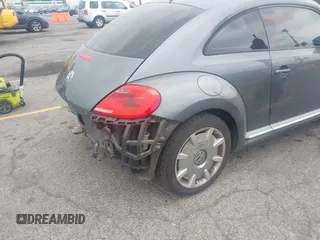 2013 Volkswagen Beetle 2.5L with VIN 3VWJP7AT6DM667477, listed as a IAAI auction lot 42215545 with 87,392 mi miles and . Bid and sale history available at DreamBid. Image 4.