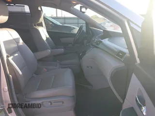 2014 Honda Odyssey Touring with VIN 5FNRL5H97EB094353, listed as a IAAI auction lot 41701712 with 141,228 mi miles and . Bid and sale history available at DreamBid. Image 5.
