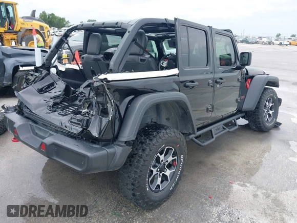 2021 Jeep Wrangler Unlimited Rubicon with VIN 1C4HJXFG7MW662092, listed as a IAAI auction lot 42139521 with 32,055 mi miles and . Bid and sale history available at DreamBid. Image 4.