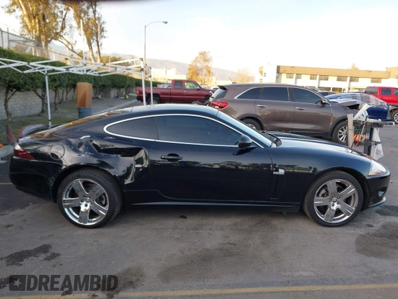 2008 Jaguar XK with VIN SAJWA43B985B23987, listed as a IAAI auction lot 41197091 with 54,803 mi miles. Bid and sale history available at carsss.com. Image 13.