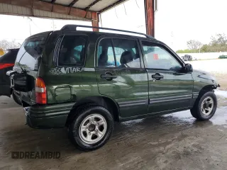 2000 Suzuki Vitara JLS z VIN 2S3TE52VXY6110157, wystawiony jako Copart lot #79173714 z przebiegiem 165 283 mil mil oraz Nie do naprawy. Historia ofert i sprzedaży dostępna na DreamBid. Obrazek 3.