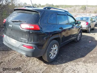2016 Jeep Cherokee Sport with VIN 1C4PJLAS9GW208334, listed as a IAAI auction lot 41449928 with 163,826 mi miles. Bid and sale history available at carsss.com. Image 4.