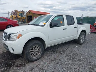 2014 Nissan Frontier SV with VIN 1N6AD0EV2EN718895, listed as a IAAI auction lot 40332972 with 53,391 mi miles and . Bid and sale history available at DreamBid. Image 2.