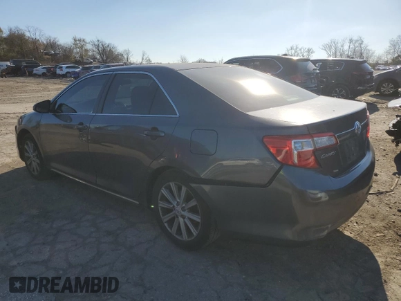 2013 Toyota Camry L with VIN 4T4BF1FK7DR285575, listed as a Copart auction lot 82877124 with 102,946 mi miles and Salvage Title. Bid and sale history available at carsss.com. Image 2.