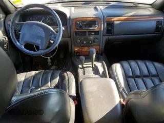 1999 Jeep Grand Cherokee Limited with VIN 1J4GW68N7XC578504, listed as a Copart auction lot 43684275 with 163,752 mi miles and Clean Title. Bid and sale history available at carsss.com. Image 8.