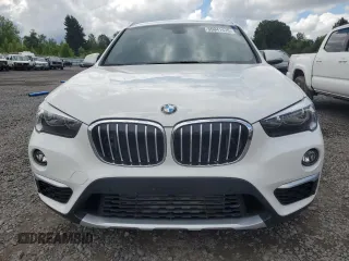 2018 BMW X1 xDrive28i with VIN WBXHT3C35J5L29298, listed as a Copart auction lot 59041435 with 27,612 mi miles and Salvage title. Bid and sale history available at DreamBid. Image 5.
