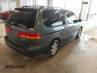 2004 Honda Odyssey EX z VIN 5FNRL18674B050429, wystawiony jako IAAI lot #41655622 z przebiegiem 257 656 mil mil oraz . Historia ofert i sprzedaży dostępna na DreamBid. Obrazek 4.