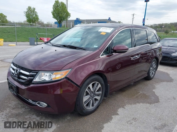 2014 Honda Odyssey Touring with VIN 5FNRL5H9XEB073156, listed as a IAAI auction lot 41990714 with 166,129 mi miles and . Bid and sale history available at DreamBid. Image 2.
