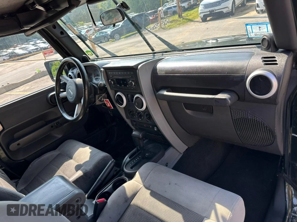 2010 Jeep Wrangler Sahara with VIN 1J4AA5D18AL222491, listed as a Copart auction lot 60045815 with 173,280 mi miles and Clean title. Bid and sale history available at DreamBid. Image 6.
