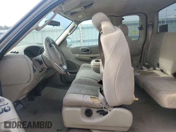 2003 Ford F-150 XL with VIN 1FTRX17LX3NA38576, listed as a Copart auction lot 54057495 with 173,811 mi miles and Salvage title. Bid and sale history available at DreamBid. Image 7.