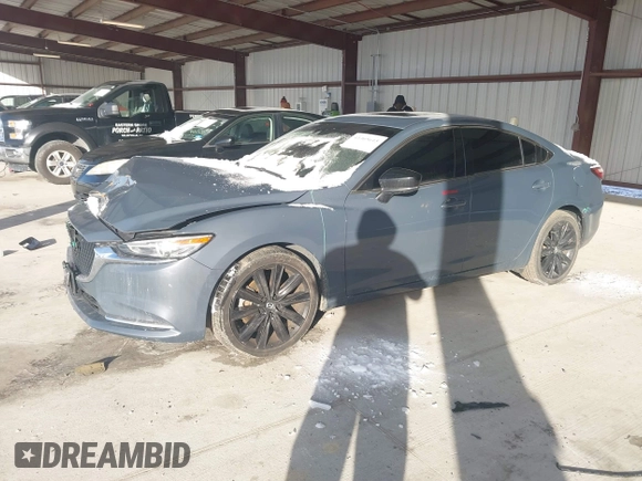 2021 Mazda 6 Carbon Edition with VIN JM1GL1WY6M1616617, listed as a IAAI auction lot 41365615 with 60,747 mi miles and . Bid and sale history available at DreamBid. Image 2.