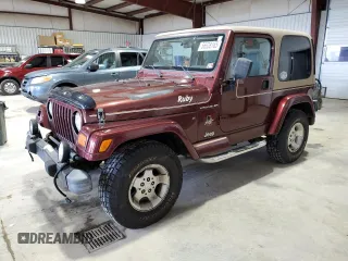 2002 Jeep Wrangler Sahara z VIN 1J4FA59S62P751858, wystawiony jako Copart lot #56638165 z przebiegiem 270 770 mil mil oraz Szkoda całkowita • Salvage title. Historia ofert i sprzedaży dostępna na DreamBid. Obrazek 1.
