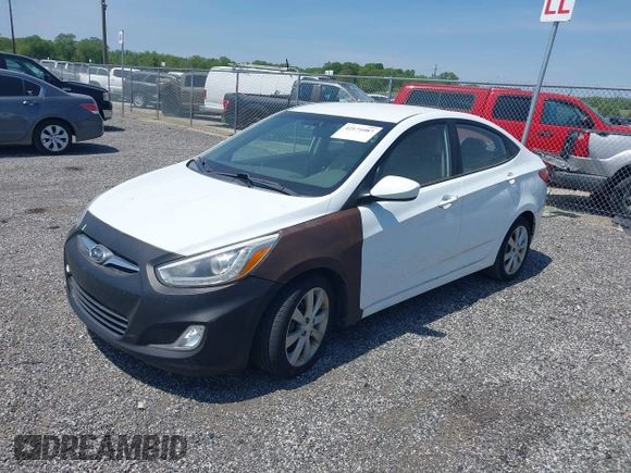 2014 Hyundai Accent GLS with VIN KMHCU4AE8EU589409, listed as a IAAI auction lot 42171087 with 209,204 mi miles. Bid and sale history available at carsss.com. Image 2.