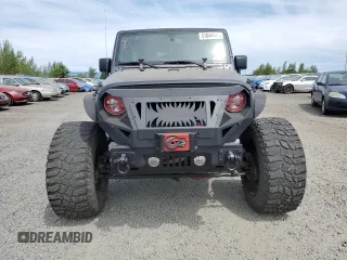 2016 Jeep Wrangler Unlimited Freedom with VIN 1C4BJWDG8GL300314, listed as a Copart auction lot 61044645 with 103,396 mi miles and Clean title. Bid and sale history available at DreamBid. Image 5.