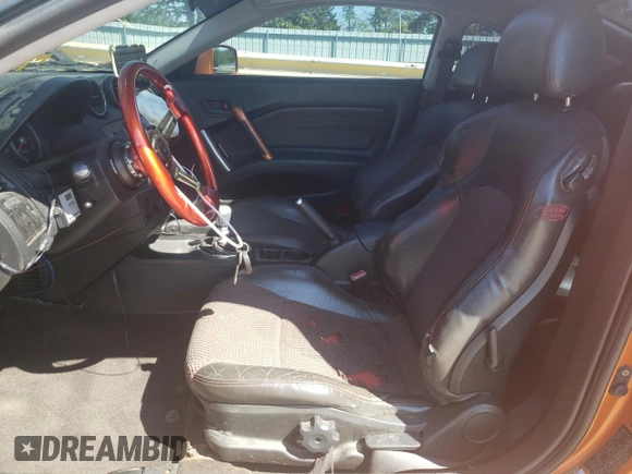 2006 Hyundai Tiburon GT z VIN KMHHN65F66U191134, wystawiony jako Copart lot #56692615 z przebiegiem 197 093 mil mil oraz Szkoda całkowita • Salvage title. Historia ofert i sprzedaży dostępna na DreamBid. Obrazek 7.