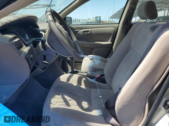 2001 Toyota Camry CE z VIN JT2BG22K410568101, wystawiony jako Copart lot #57184125 z przebiegiem Nie podano mil oraz Szkoda całkowita • Salvage title. Historia ofert i sprzedaży dostępna na DreamBid. Obrazek 7.