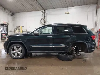 2013 Jeep Grand Cherokee Overland with VIN 1C4RJECT4DC526465, listed as a IAAI auction lot 41570663 with 116,948 mi miles. Bid and sale history available at carsss.com. Image 14.