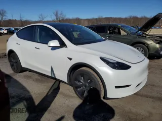 2024 Tesla Model Y with VIN 7SAYGDED9RF094494, listed as a Copart auction lot 50298115 with 7,858 mi miles and Salvage Title. Bid and sale history available at DreamBid. Image 4.