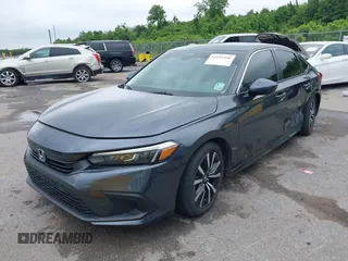 2023 Honda Civic EX with VIN 2HGFE1F73PH312228, listed as a IAAI auction lot 42185408 with 19,339 mi miles and . Bid and sale history available at DreamBid. Image 2.