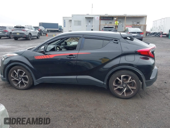 2018 Toyota C-HR XLE with VIN JTNKHMBX6J1000904, listed as a IAAI auction lot 42513117 with 77,192 mi miles and . Bid and sale history available at DreamBid. Image 14.