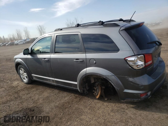 2012 Dodge Journey SXT z VIN 3C4PDCCGXCT177675, wystawiony jako Copart lot #52396045 z przebiegiem 168 203 mil mil oraz Szkoda całkowita • Salvage title. Historia ofert i sprzedaży dostępna na DreamBid. Obrazek 2.