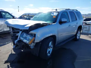 2013 Chevrolet Tahoe LT with VIN 1GNSKBE01DR157083, listed as a IAAI auction lot 41759189 with 153,403 mi miles and . Bid and sale history available at DreamBid. Image 2.