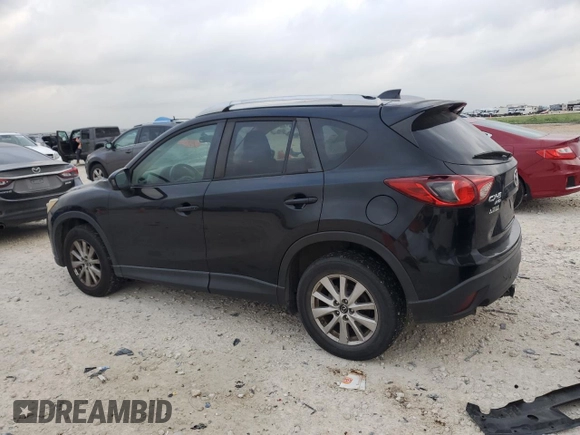 2015 Mazda CX-5 Touring with VIN JM3KE4CYXF0446370, listed as a Copart auction lot 52392575 with 132,419 mi miles and Salvage Title. Bid and sale history available at DreamBid. Image 2.