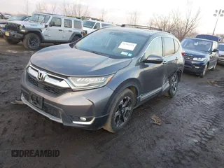 2017 Honda CR-V Touring with VIN 2HKRW2H94HH617081, listed as a IAAI auction lot 41294254 with 145,140 mi miles. Bid and sale history available at carsss.com. Image 2.