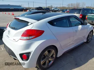 2015 Hyundai Veloster Turbo with VIN KMHTC6AE4FU234611, listed as a IAAI auction lot 42059915 with 107,388 mi miles. Bid and sale history available at carsss.com. Image 4.