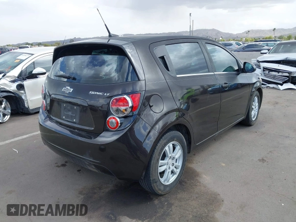 2014 Chevrolet Sonic LT with VIN 1G1JC6SHXE4135948, listed as a IAAI auction lot 41949833 with 127,202 mi miles. Bid and sale history available at carsss.com. Image 4.