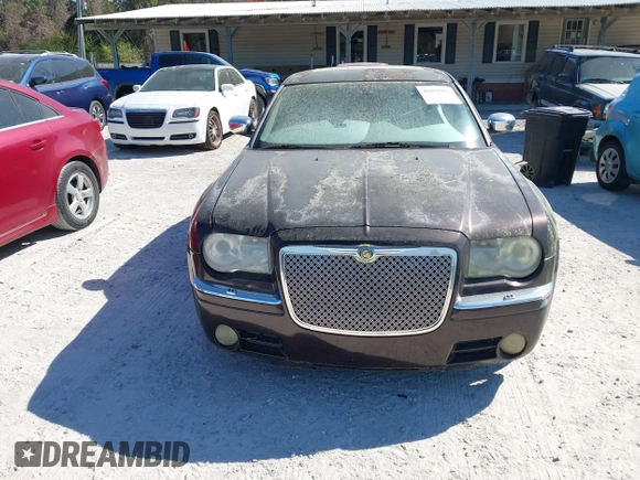 2005 Chrysler 300 with VIN 2C3AA63H75H577363, listed as a IAAI auction lot 41892999 with 229,634 mi miles. Bid and sale history available at carsss.com. Image 6.