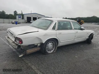 1999 Jaguar XJ with VIN SAJKX6049XC858040, listed as a Copart auction lot 64894604 with 218,054 mi miles and Salvage Title. Bid and sale history available at carsss.com. Image 3.