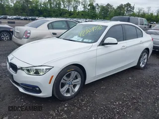 2018 BMW 3 Series 330i xDrive with VIN WBA8D9C52JEM32318, listed as a IAAI auction lot 42309352 with 61,828 mi miles and . Bid and sale history available at DreamBid. Image 2.