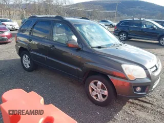 2009 Kia Sportage LX with VIN KNDJE723097623239, listed as a IAAI auction lot 41233933 with 169,444 mi miles. Bid and sale history available at carsss.com. Image 1.