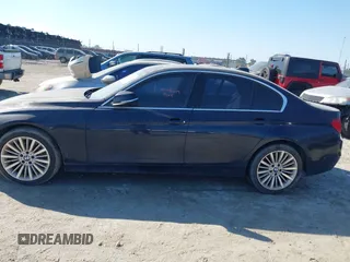 2014 BMW 3 Series 335i with VIN WBA3A9C54EF477943, listed as a IAAI auction lot 41632554 with 102,273 mi miles. Bid and sale history available at carsss.com. Image 14.