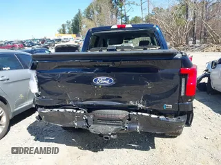 2024 Ford F-150 Lightning Flash with VIN 1FT6W3L75RWG30755, listed as a IAAI auction lot 41817158 with 1,932 mi miles and . Bid and sale history available at DreamBid. Image 16.