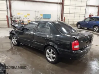 2003 Mazda Protege DX with VIN JM1BJ226431112902, listed as a IAAI auction lot 41939907 with 184,618 mi miles and . Bid and sale history available at DreamBid. Image 3.