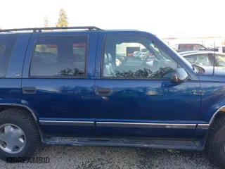 1997 Chevrolet Tahoe with VIN 1GNEK13R4VJ418974, listed as a IAAI auction lot 41560411 with 198,170 mi miles. Bid and sale history available at carsss.com. Image 13.