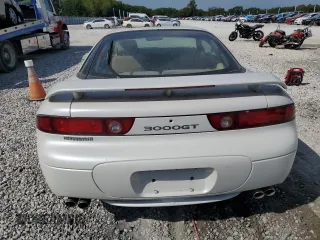 1996 Mitsubishi 3000GT GT z VIN JA3AM84J7TY005775, wystawiony jako Copart lot #70461554 z przebiegiem 102 704 mil mil oraz Tytuł czysty. Historia ofert i sprzedaży dostępna na DreamBid. Obrazek 6.