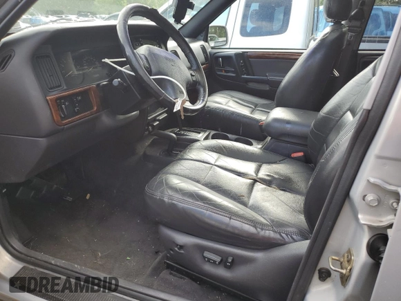 1998 Jeep Grand Cherokee Limited с VIN 1J4GZ78Y0WC245194, выставлен на аукционе Copart как лот 57838825 с пробегом 199 412 миль миль и Списание • Salvage title. История ставок и продаж доступна на DreamBid. Изображение 7.
